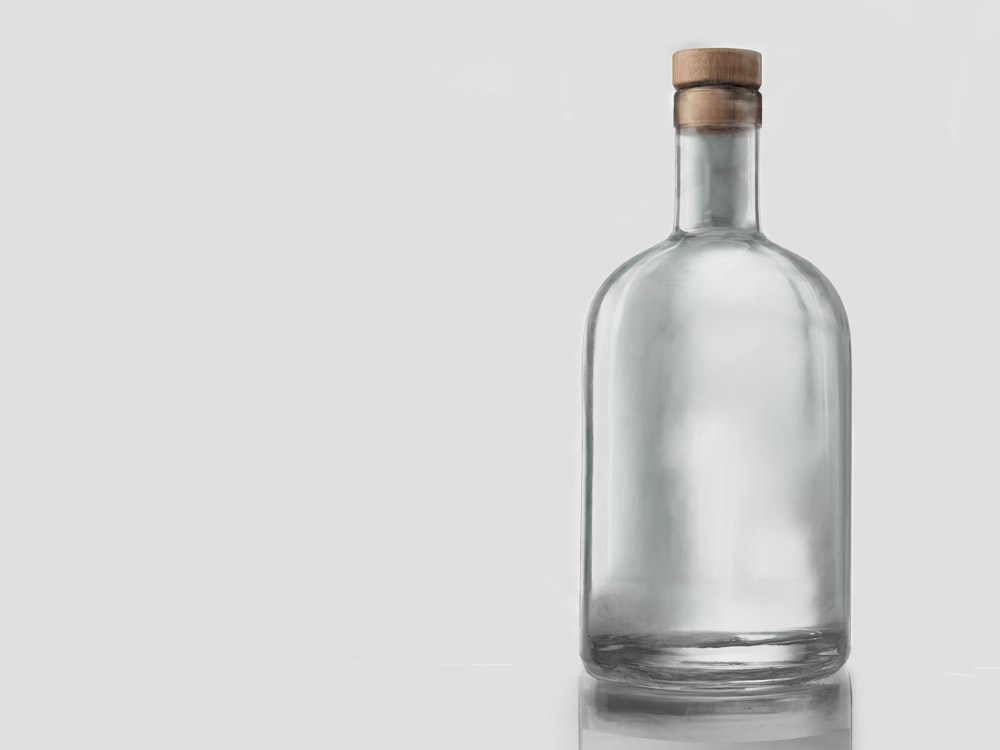Clear glass bottle with a wooden topped stopper
