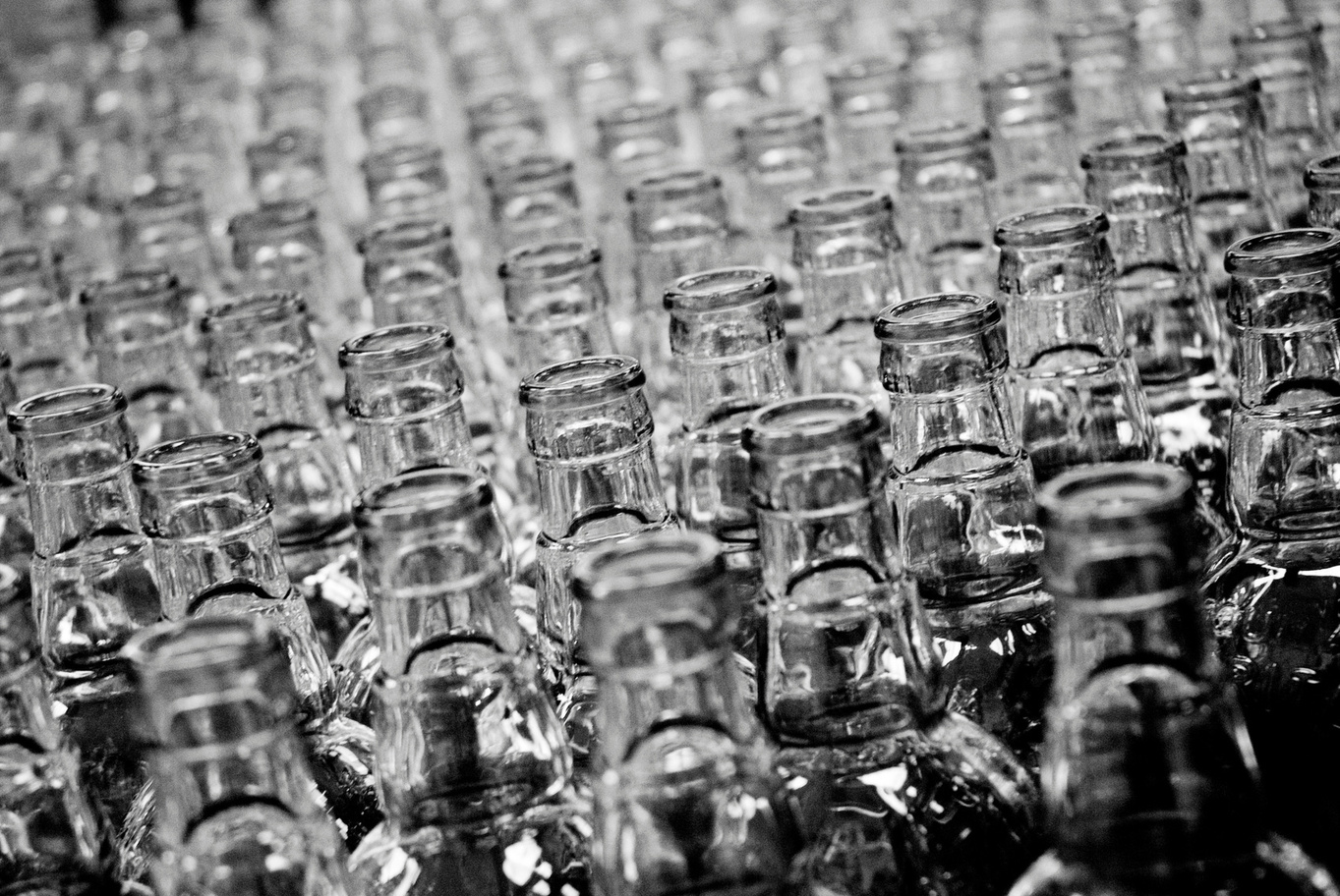 Rows of glass jars in production